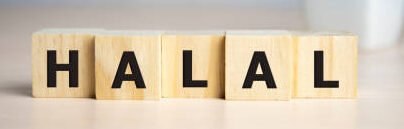 Letter block in word halal on wooden blocks.
